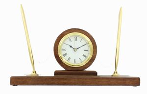 WALNUT FINISH PEN SET WITH QUARTZ BRASS CLOCK WITH BLACK ENGRAVING PLATE. 11 INCH LENGTH X 3 INCH WIDTH X 5 1/2 HEIGHT.