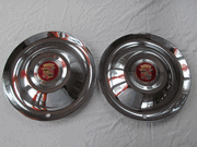 1951 CADILLAC & 1952 CADILLAC HUB CAPS PAIR NEW OLD STOCK