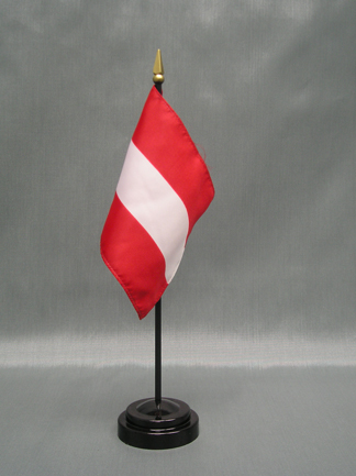 Three Austria Mini Flags in Diagonal Formation on Grey Background Stock Photo