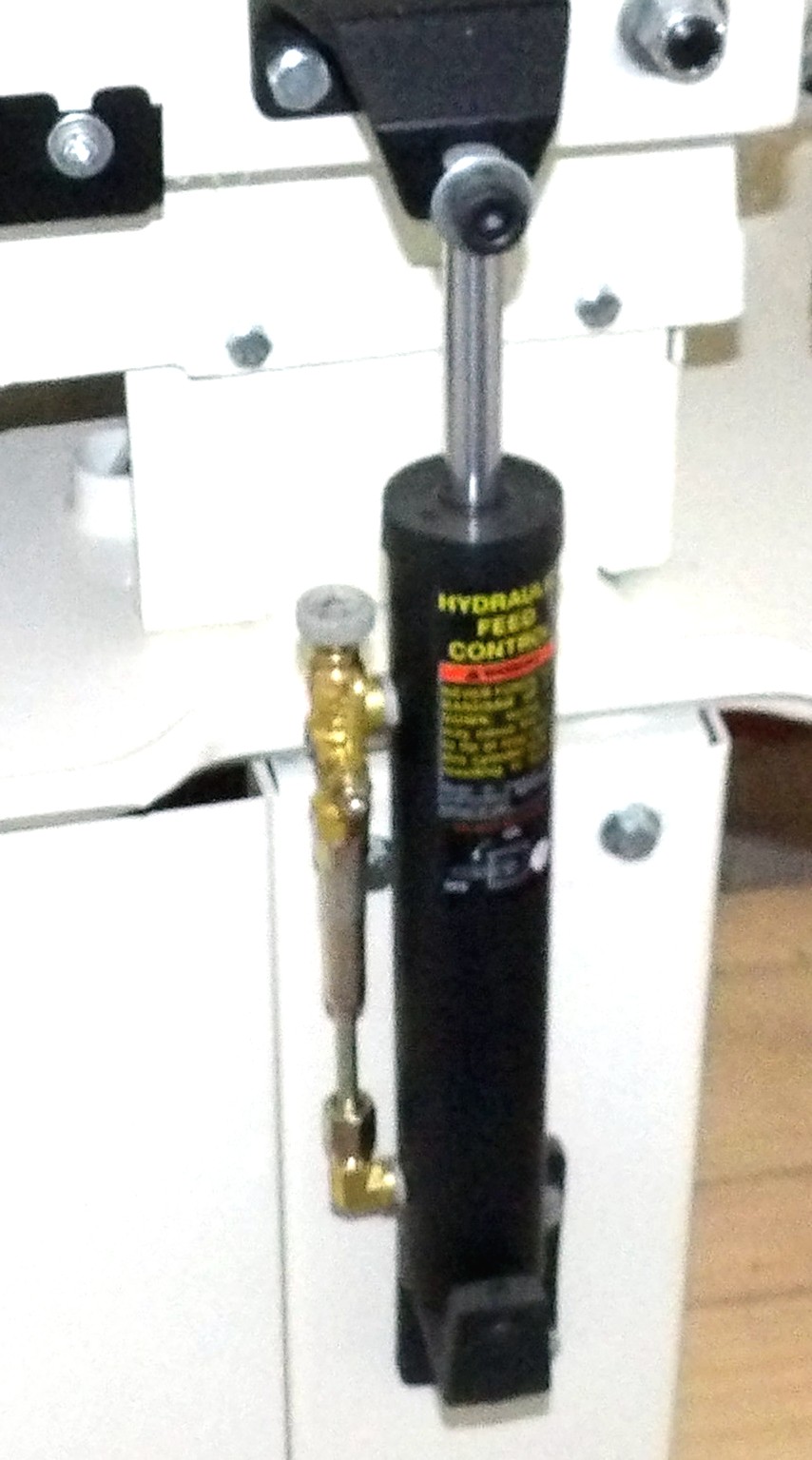 Metal band saw hydraulic downfeed control cylinder