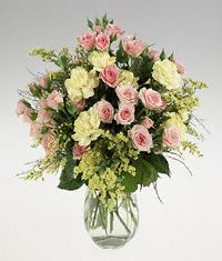 A posy vase of mixed stems.