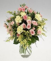 A posy vase of mixed stems.
