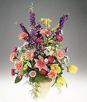 A vase arrangement filled with spring flowers.