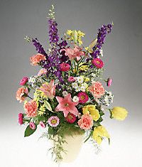 A vase arrangement filled with spring flowers.