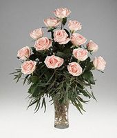 Fifteen pink roses in clear glass vase.