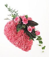 Heart shaped tribute of pink carnations and roses sympathy