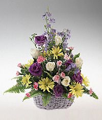 Mixed basket of flowers for a newborn.