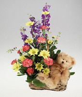 Mixed basket of flowers with plush bear.