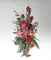 Mixed colorful flowers on an easel.