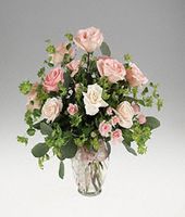 Mixed roses in a ginger jar vase.