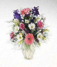 Mixed summery flowers in frosted vase.