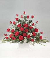 Red roses in a handled basket.