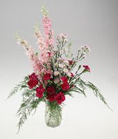 Small arrangement of dainty mixed flowers.