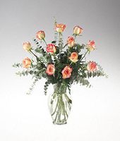 Twelve Konfetti roses in clear glass.
