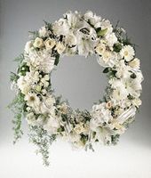 Wreath of mixed white flowers.