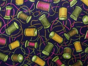 Spools of Thread on Dark Blue