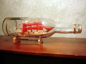 Red SAILBOAT in a BOTTLE. Tropical Tiki Decoration. Nautical Decor.