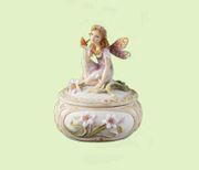 Fairy Pondering Jewelry Box In the enchanted world of Fairyland, our fairies are collector's favorites. Each charming figure is handcrafted with careful attention to detail, from the delicately carved wings to each figure's floral adornment.    Hand pa