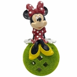 Minnie Mouse Sitting on Garden Ball