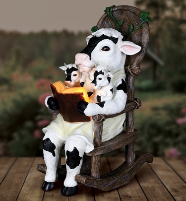 Solar Cows Reading in Rocking Chair - Click to enlarge
