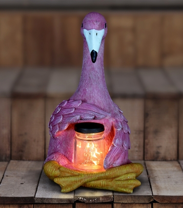 Solar Flamingo Seated Holding Jar of Fireflies - Click to enlarge