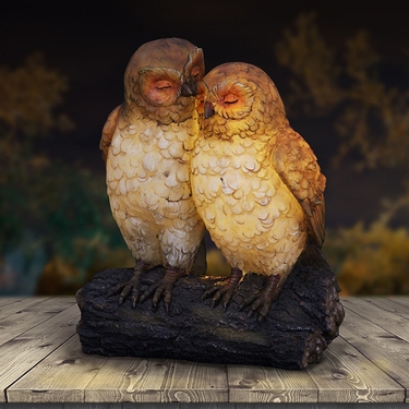 Solar Owl Pair on Stump - Click to enlarge