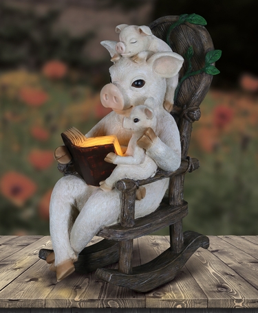 Solar Pigs Reading in Rocking Chair - Click to enlarge