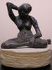 Green Patina Seated Nude, Arms Up, with  Hand-carved Sandstone Base<br><SMALL>Mary Pohlad</SMALL></font>