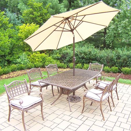 Oakland Living Elite 9 Piece Dining Set with 70"x38" Boat Shaped Table, 6 Cushioned Arm Chairs and Beige Umbrella in Antique Bronze