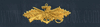 Seabee Combat Warfare Specialist, Officer Breast Device, Embroidered in Gold Thread on BLUE coverall fabric Seabee Combat Warfare Specialist, Officer Breast Device, Embroidered in Gold Thread on BLUE coverall fabric