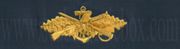 Seabee Combat Warfare Specialist, Officer Breast Device, Embroidered in Gold Thread on BLUE coverall fabric