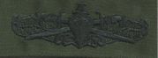 24 Surface Warfare Officer Breast Device, on Olive green fabric