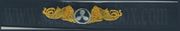 SUBMARINE ENGINEERING, Breast Device, Embroidered in Gold Thread on BLUE coverall fabric 